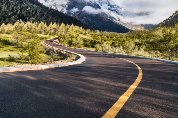 istock Mountain road, fog 2178450797