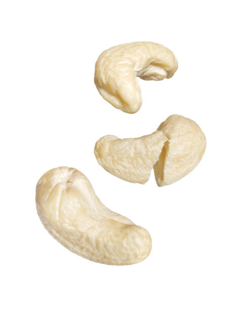 istock Whole and cracked dried cashew close-up isolated on a white background 2178451005