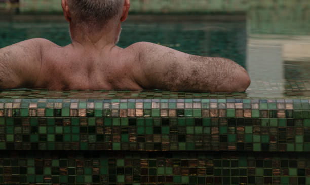 istock Adult man relaxing in swimming pool 2178454277