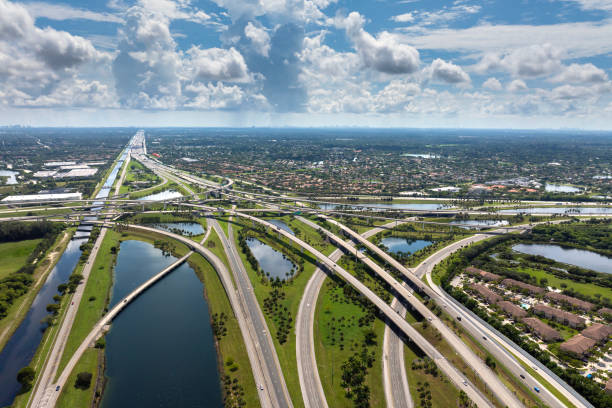 istock Massive highway intersection in American city area. Stacked elevated interchange lanes for express passing of car traffic. Miami, Florida 2178454407
