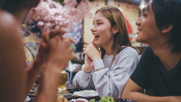 istock Group of friends in a Japanese restaurant. 2178454654