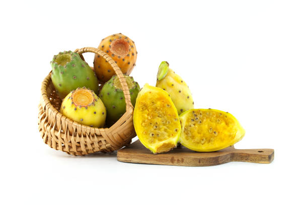 istock Fresh prickly pears in basket and on wooden board isolated on white background 2178460055