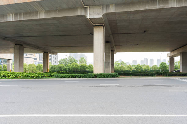 istock Concrete structure and asphalt road space under the overpass in the city 2178460324