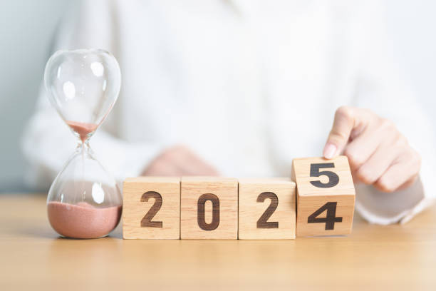 istock 2024 end year to Happy New Year 2025 with hourglass on table. Resolution, time, plan, goal, motivation, reboot, countdown and New Year holiday concepts 2178461525