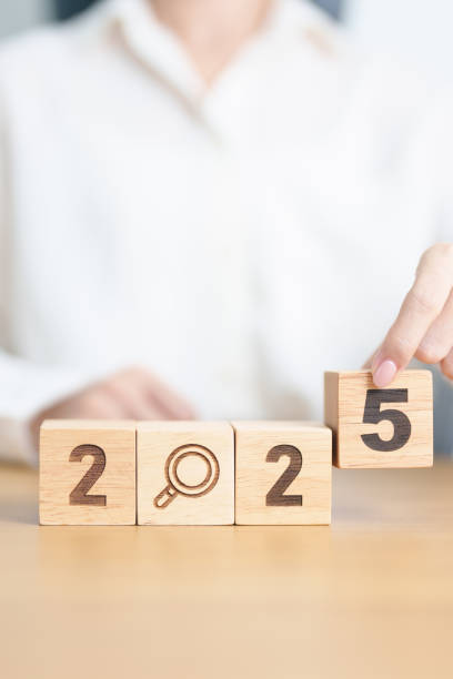 istock 2025 block with magnifying glass icon. SEO, Search Engine Optimization, hiring , Advertising, Idea, Strategy, marketing, Keyword, Content and New Year start concepts 2178461527