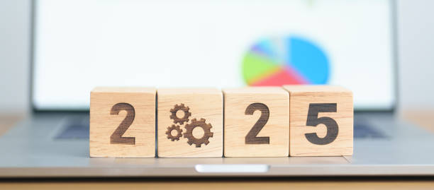 istock 2025 block with gear icon against laptop computer. Business Process, Team, teamwork, Goal, Target, Resolution, strategy, plan, Action, motivation, change, brainstorm and New Year start concepts 2178461647