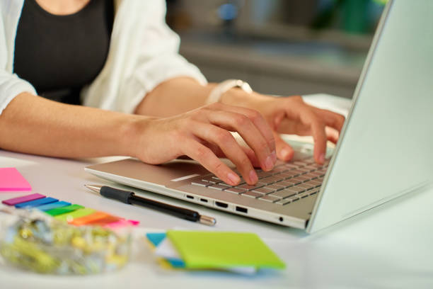 istock Woman working remotely from home office typing on laptop keyboard 2178461928