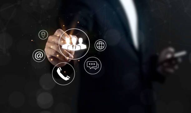 istock Businessman choosing on virtual screen icons represent Contact us or Customer support hotline people connect. 2178463789