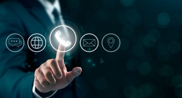 istock Businessman touching on virtual screen icons represent Contact us or Customer support hotline people connect. 2178463790