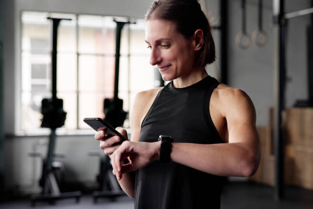 istock Athlete Woman Checking Smart watch 2178465701