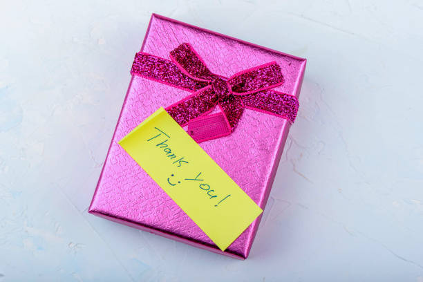 istock Gift box with a note of thanks on a textured background. 2178468727