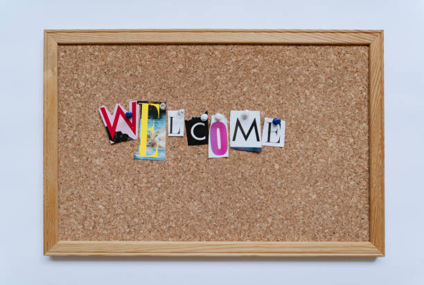Welcome word pinned on cork board