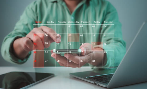 istock Businessman marking dates on virtual calendar, Time management concept, Planning work to increase efficiency, Business project planning, Effective time management and reduce working time. 2178473680