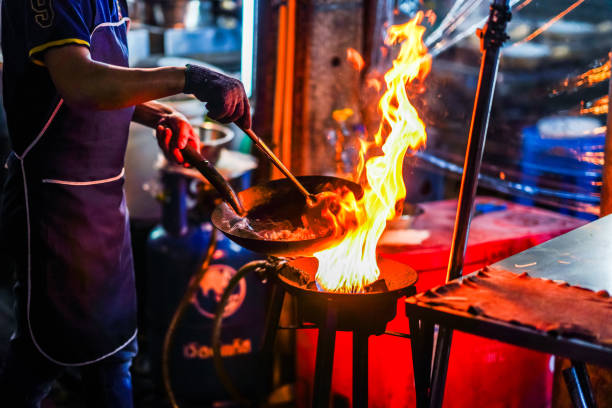 istock A cook cooks over a big fire for that wok-hei 2178475515