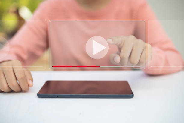 istock A woman is pointing at a video on a tablet 2178476855
