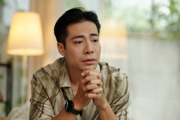 istock Sad Man Sitting In The Room 2178478074