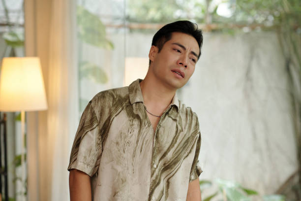 istock Pensive Man Standing In The Room 2178478127