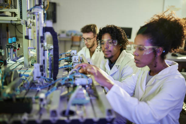 istock Team of young scientist working on production line in a lab. 2178478250