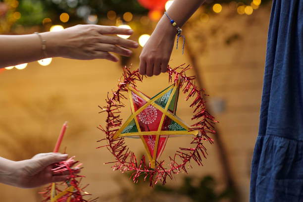 Close-up of family decorating their yard to holiday together