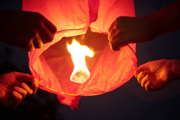 istock Couple Holding Sky Lantern And Launching It 2178480928