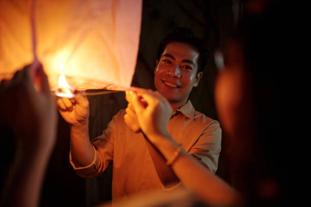 istock Happy Couple Celebrating Holiday With Lantern 2178480961