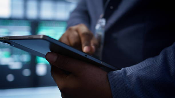 istock Extreme close up shot of worker in server hub using tablet 2178482595