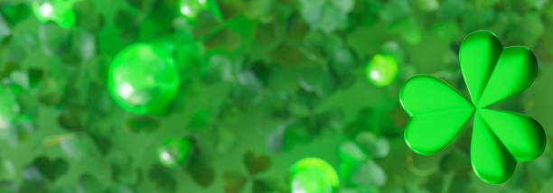istock Vibrant St. Patrick's Day themed banner featuring large, green three-leaf clover in the foreground with smaller, slightly blurred clovers in the background. Luck and Irish heritage. Copy space. 3D. 2178483334