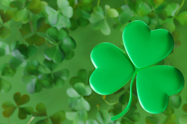 istock Vibrant St. Patrick's Day themed design featuring large, green three-leaf clover in the foreground with smaller, slightly blurred clovers in the background. Luck and Irish heritage. Copy space. 3D. 2178483383