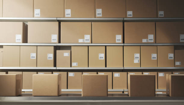 istock Boxes on the conveyor belt at the warehouse 2178483627
