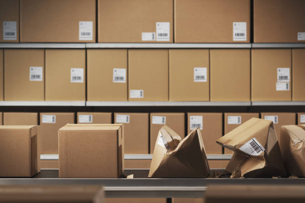 istock Crushed cardboard boxes on the conveyor belt 2178484185