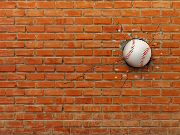 istock Baseball breaks through the wall, sports concept, strength. 2178484283