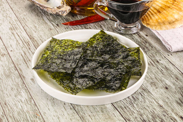 istock Green nori seaweed chips with soya sauce 2178484498