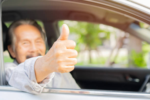 istock Mature man showing his thumb up with having fun during road trip vacation 2178485807