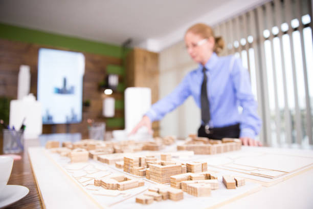 istock Close up of female architect working on real estate project 2178486077