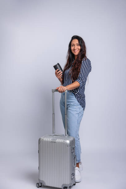 istock Confident Woman Standing with Luggage 2178489340