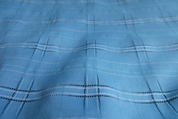 Blue and white tartan cotton fabric background closeup