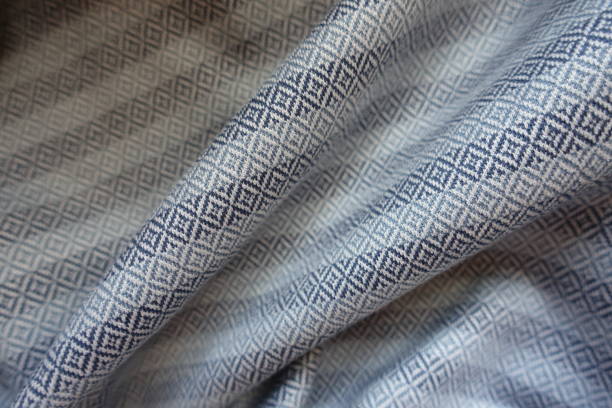 Folded ornamental cotton fabric in shades of grey