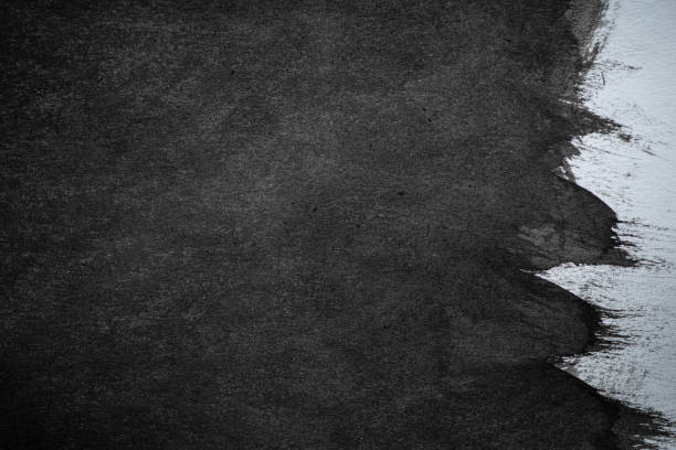 istock Black ink splashing on a dark background 2178494689