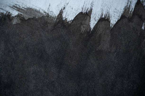 istock Black ink splashing on a dark background 2178494731