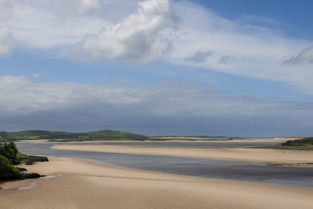 istock The Gweebarra River meets the Atlantic Ocean during low tide, exposing vast sandy banks and a vibrant summer sky in Ireland 2178497539