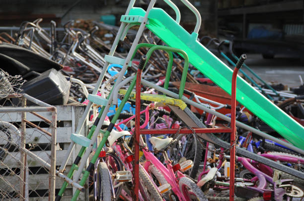 istock Recycling center. Assorted bicycles, slides and lawn mowers. 2178498266