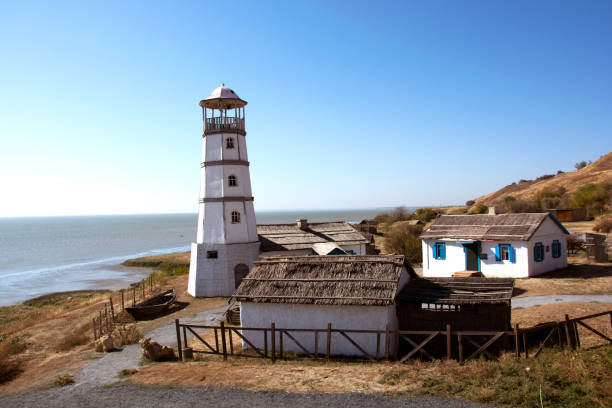 Autumn October photo lighthouse on the seashore.
