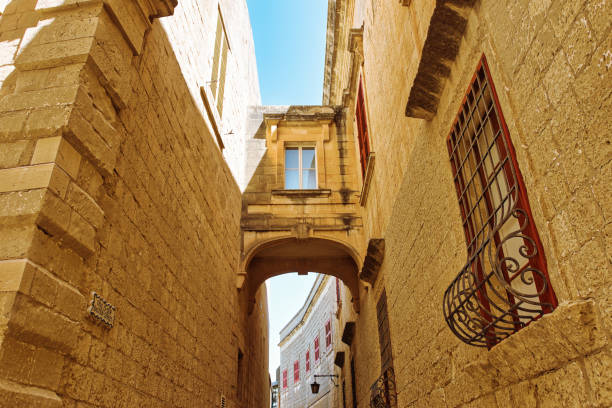 MDINA CITY, MALTA - AUGUST 05, 2021. The Silent City. This was once the Capital City of Malta. The houses are built of sandstone which is traditional for Malta. During summer on a hot sunny morning.