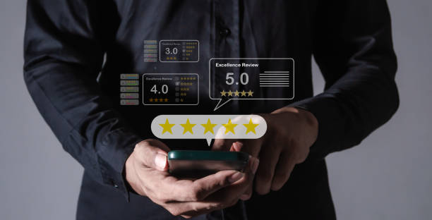 istock Excellence Review, Young Man hand using smartphone mobile with five star to review and give 5 stars with very good results in service, Good review 5 star rating choice feedback 2178502189