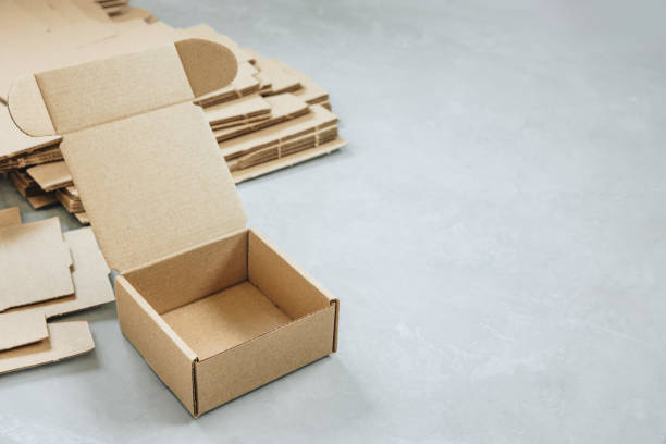 istock Paper Box. Brown paper Box. Brown cardboard box on gray background, opened empty inside. Square carton box for gift and delivery 2178503644