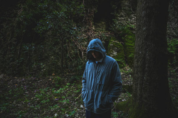 istock Man with hood jacket in woodland. 2178503918