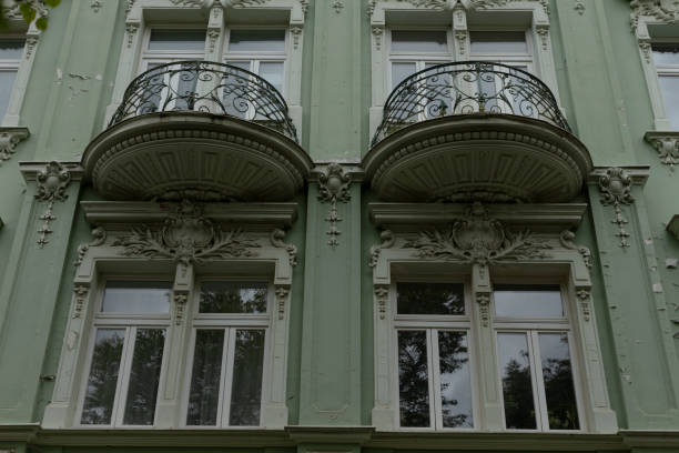 istock There exists a green building that features two balconies at the top 2178504372