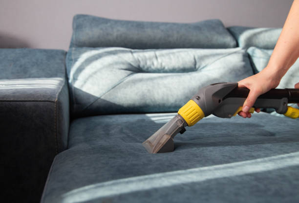 istock Cleaning a sofa with fabric upholstery from dirt with a professional vacuum cleaner, close-up. Copy space for text, chemical solution 2178505893