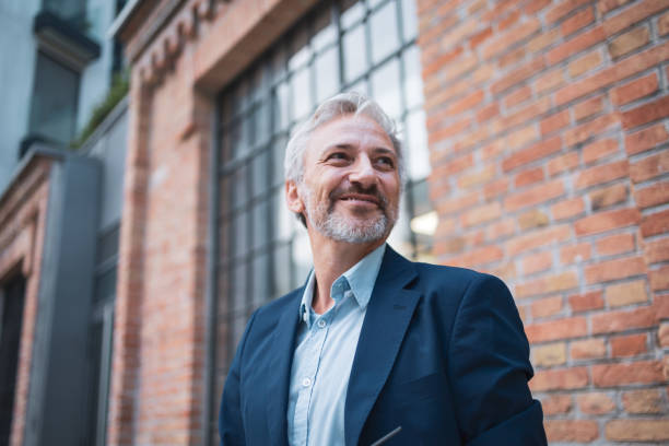 istock Confident mature businessman smiling in urban office setting 2178507055