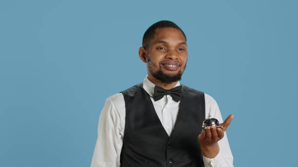 istock Professional bellboy ringing service bell and advertising concierge assistance 2178507375